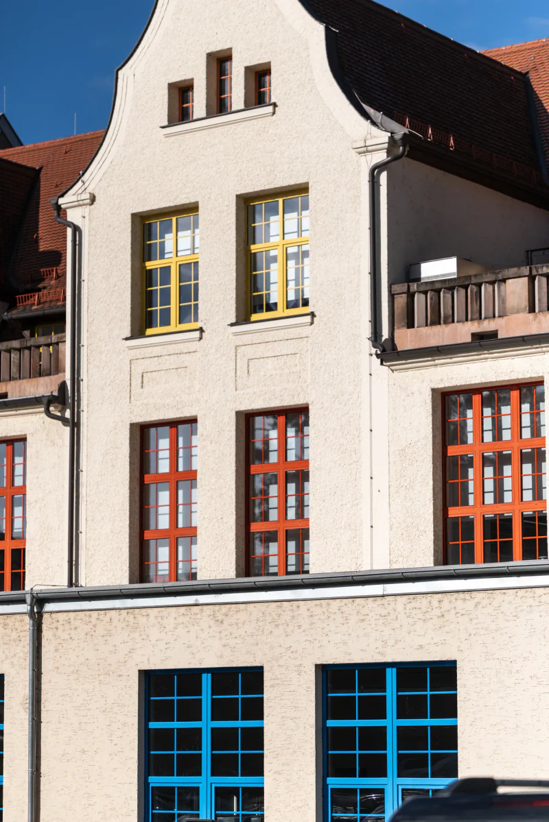 Blue, red and yellow window frames on the Faber-Castell factory façade.