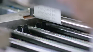 The Faber-Castell name and logo being applied to dark Grip pencils.