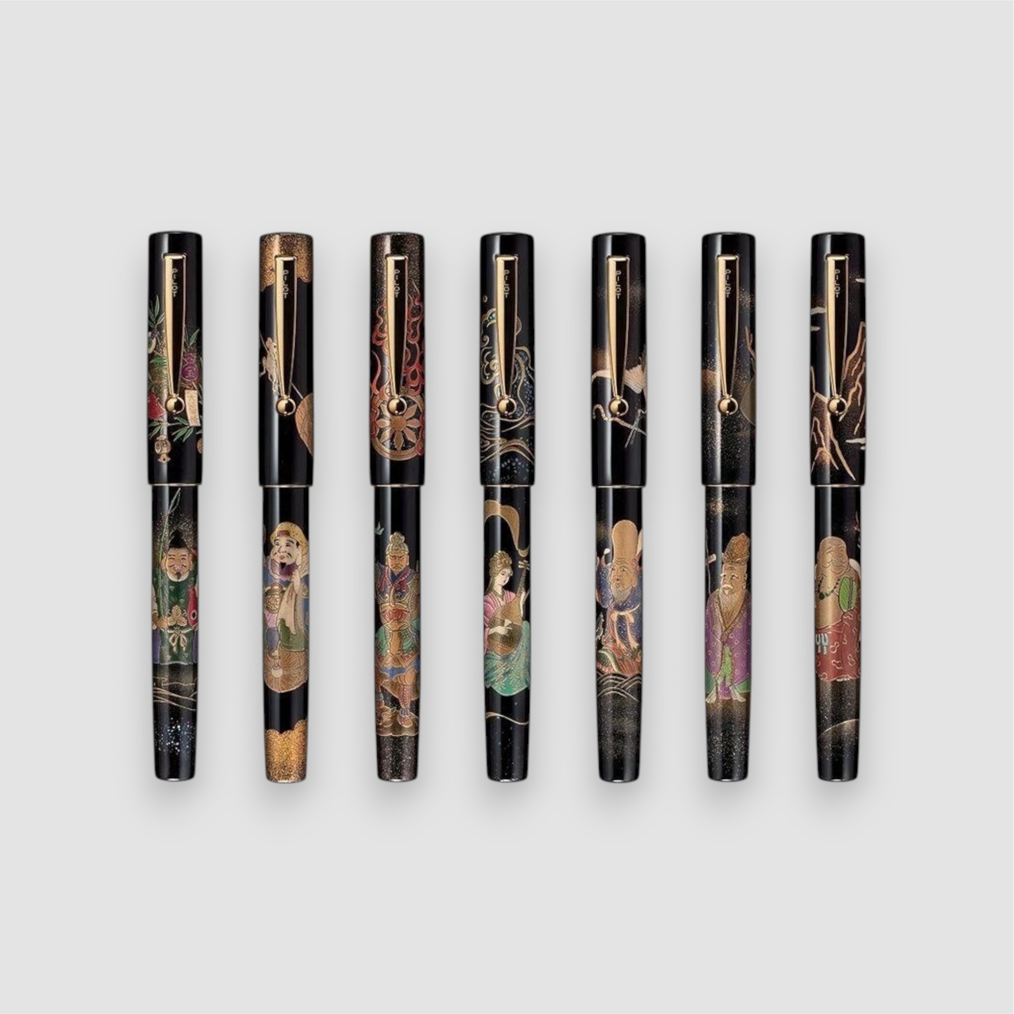 The seven individually sold Pilot anniversary pens with clips and their different maki-e designs