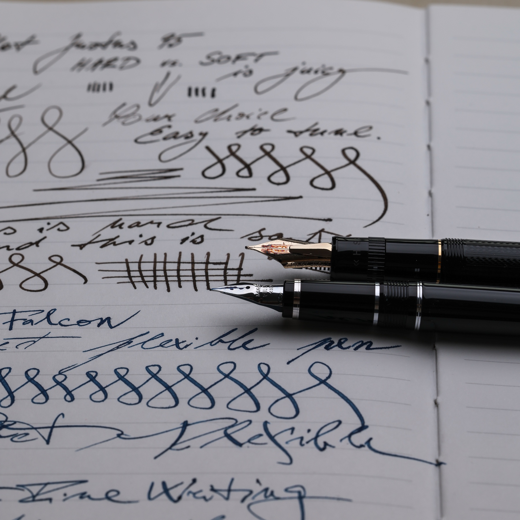 Close comparison of the Pilot Justus 95 and Pilot Falcon nibs over writing samples