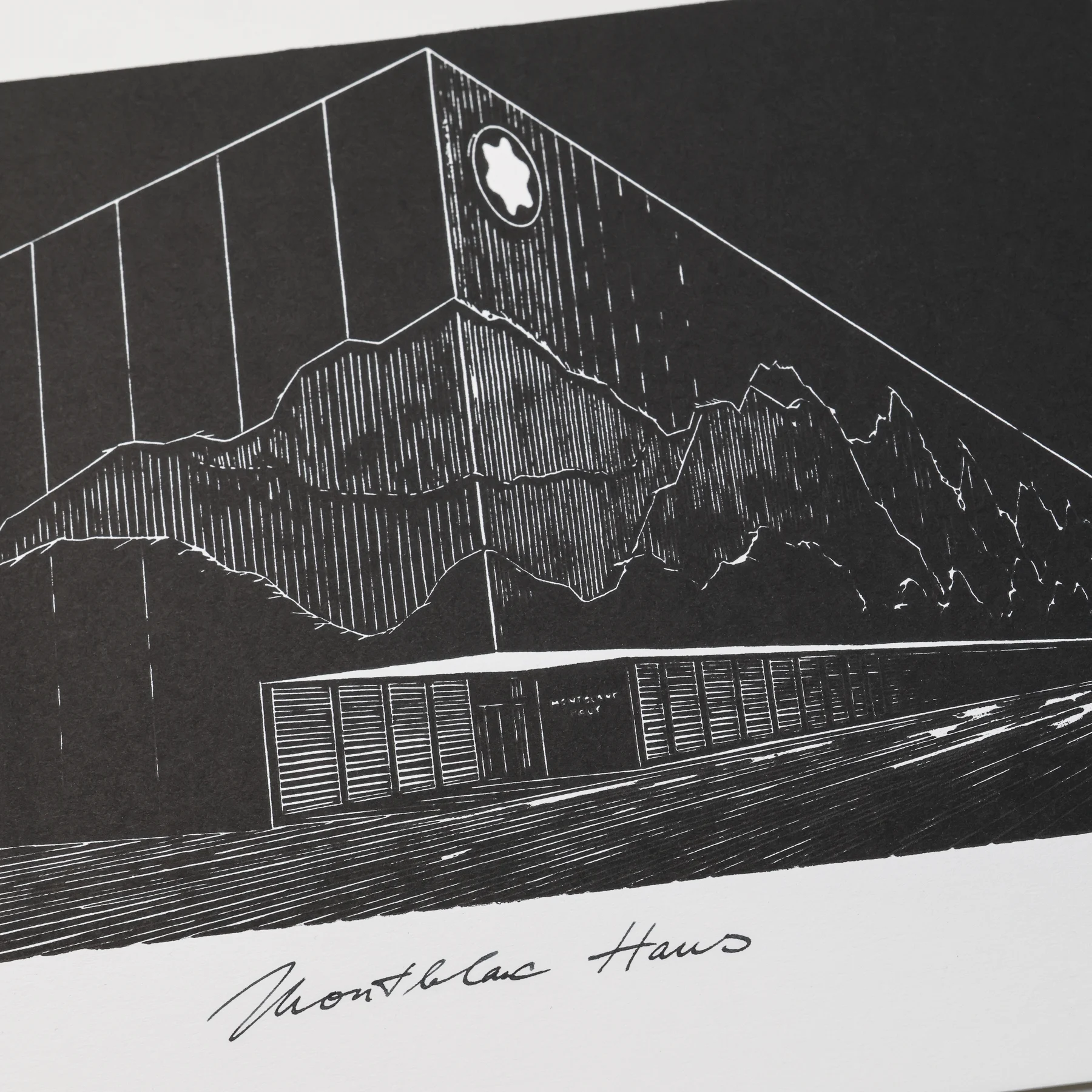 Close-up of the Montblanc Haus linocut showing the mountain silhouette, facade lines and entrance